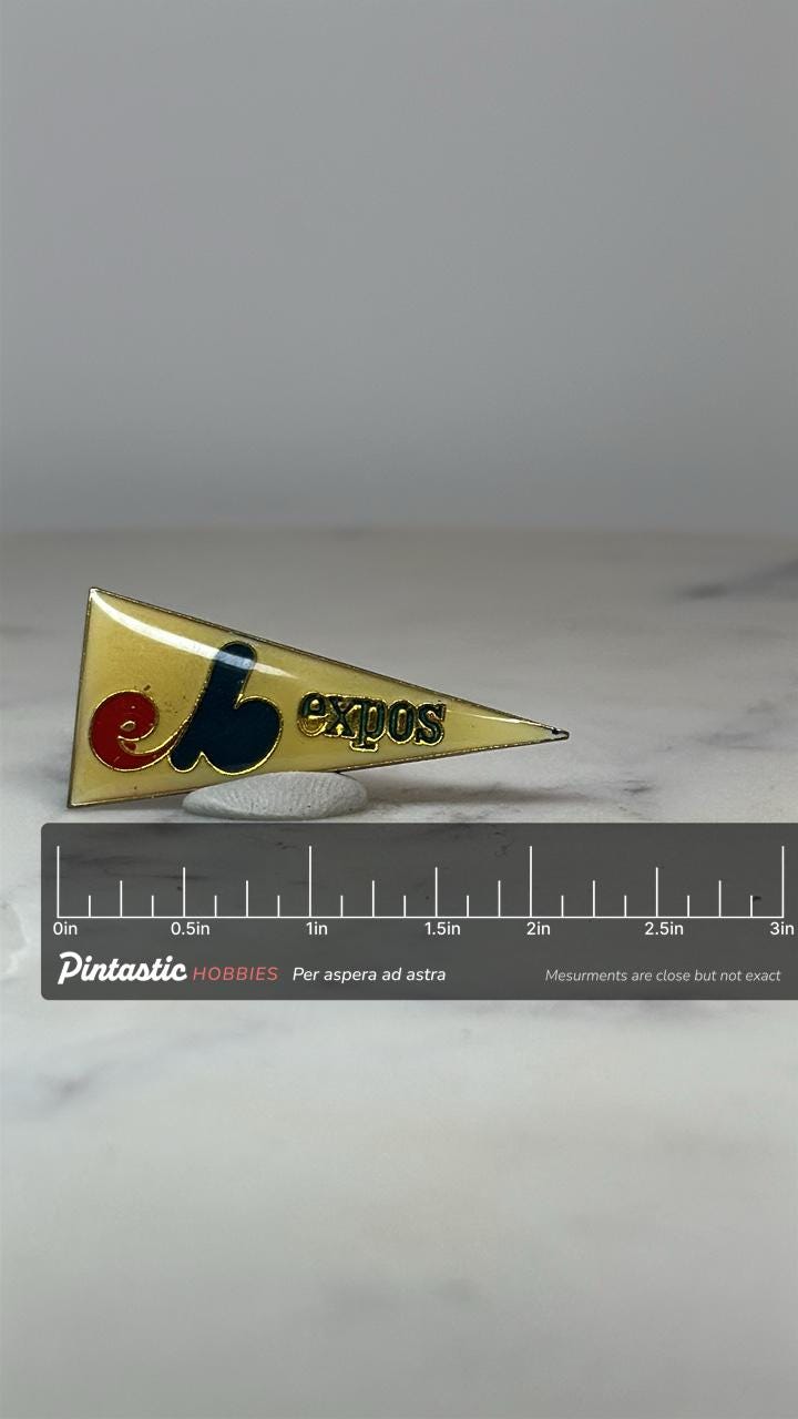 Montreal Expos Pennant Pin: Yellow Enamel - Vintage Sports Accessory with ruler overlay for size reference