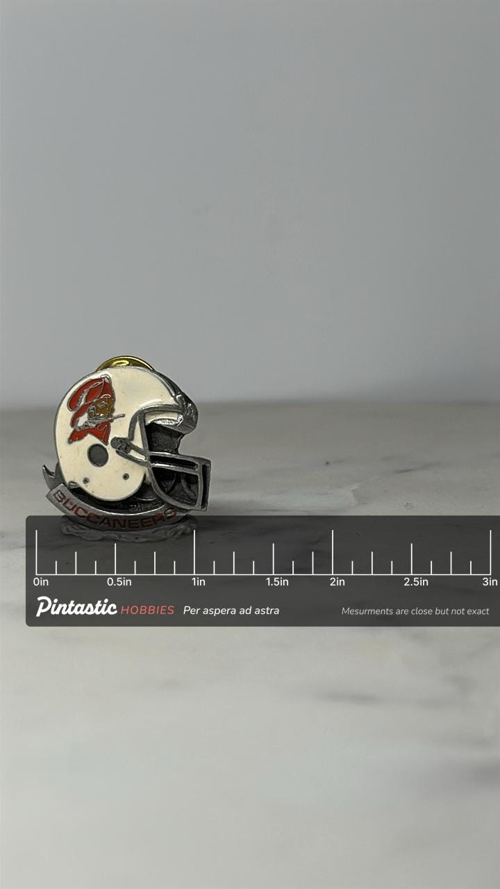 Tampa Bay Buccaneers Helmet Pin: White Enamel Pewter - Vintage NFL Accessory with ruler overlay for size reference