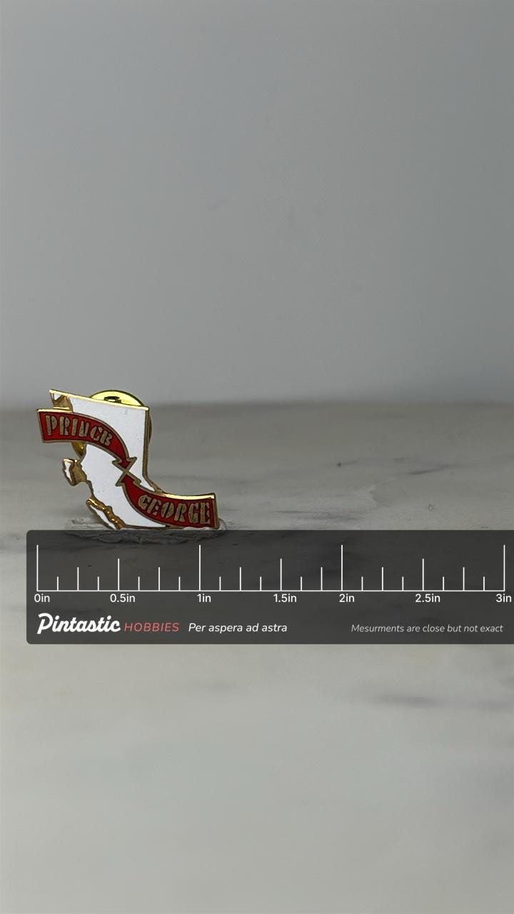 Prince George Lapel Pin: Red & White Enamel - Vintage Souvenir Accessory with ruler overlay for size reference