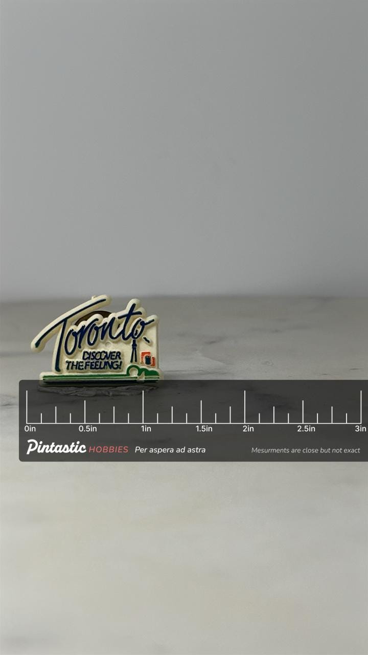 Toronto Souvenir Pin: Cream Enamel Finish - Vintage Travel Accessory with ruler overlay for size reference