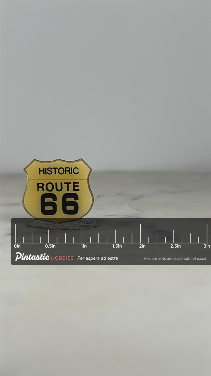 Historic Route 66 Pin: Yellow Enamel Shield - Road Trip Souvenir Accessory with ruler overlay for size reference