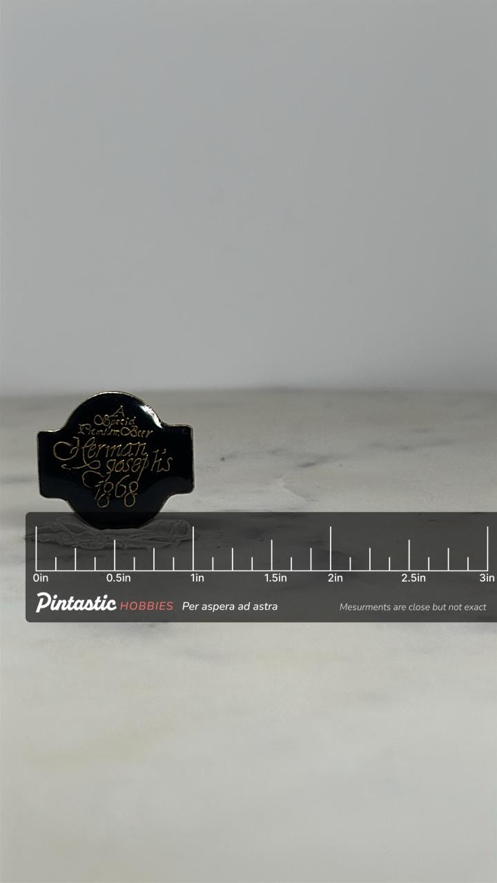 Herman Joseph’s Beer Pin: Black Enamel Gold Script - Brewery Collectible Accessory with ruler overlay for size reference