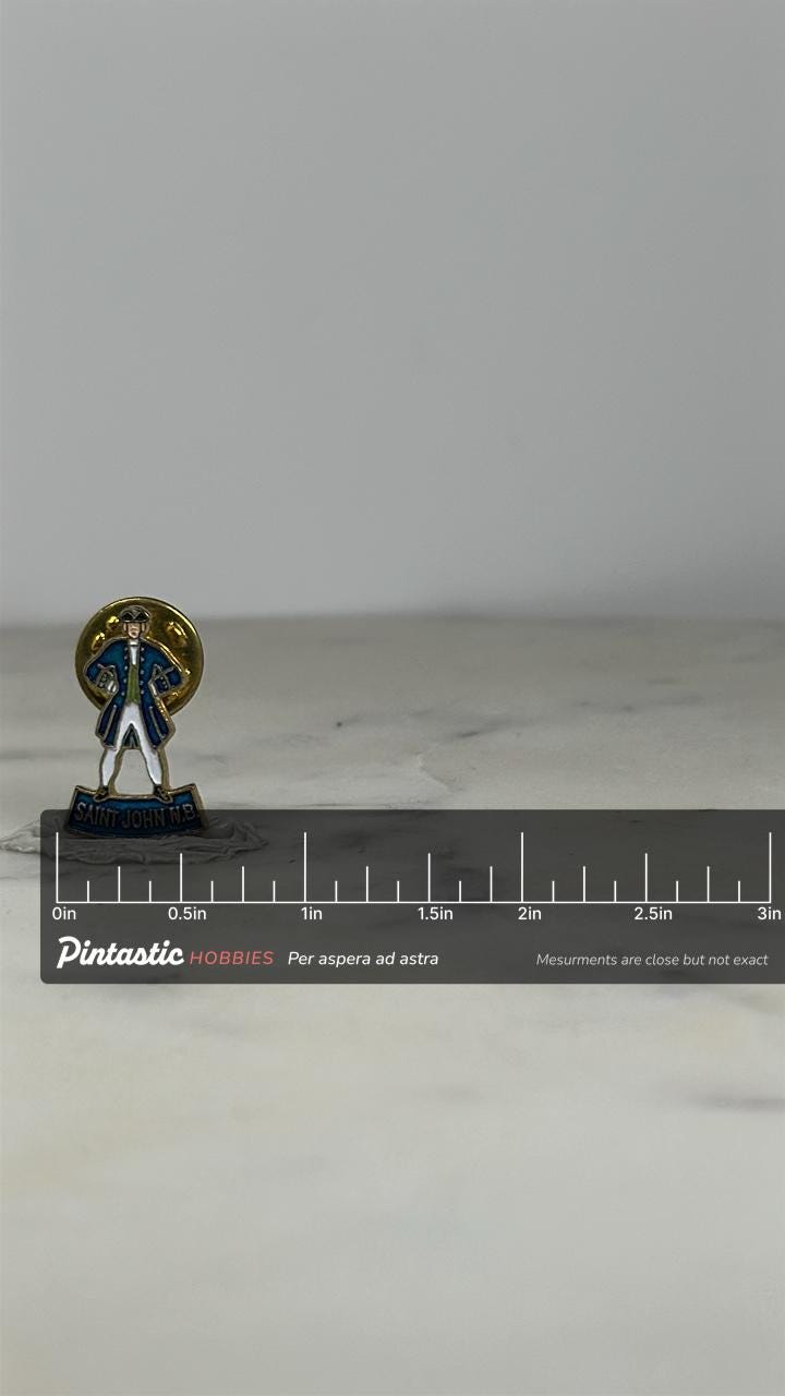 Saint John N.B. Souvenir Pin: Enamel Gold Tone - Vintage Travel Accessory with ruler overlay for size reference