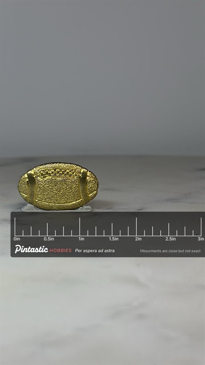 Textured Gold Tone Football Pin - Vintage Sports Accessory with ruler overlay for size reference