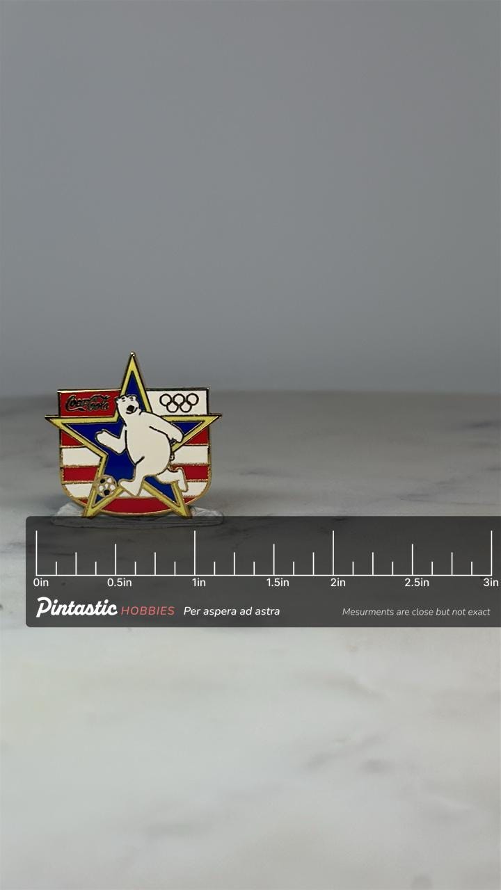 Coca-Cola Olympic Soccer Bear Pin: Red White Blue Enamel - 1990s Sports Accessory with ruler overlay for size reference