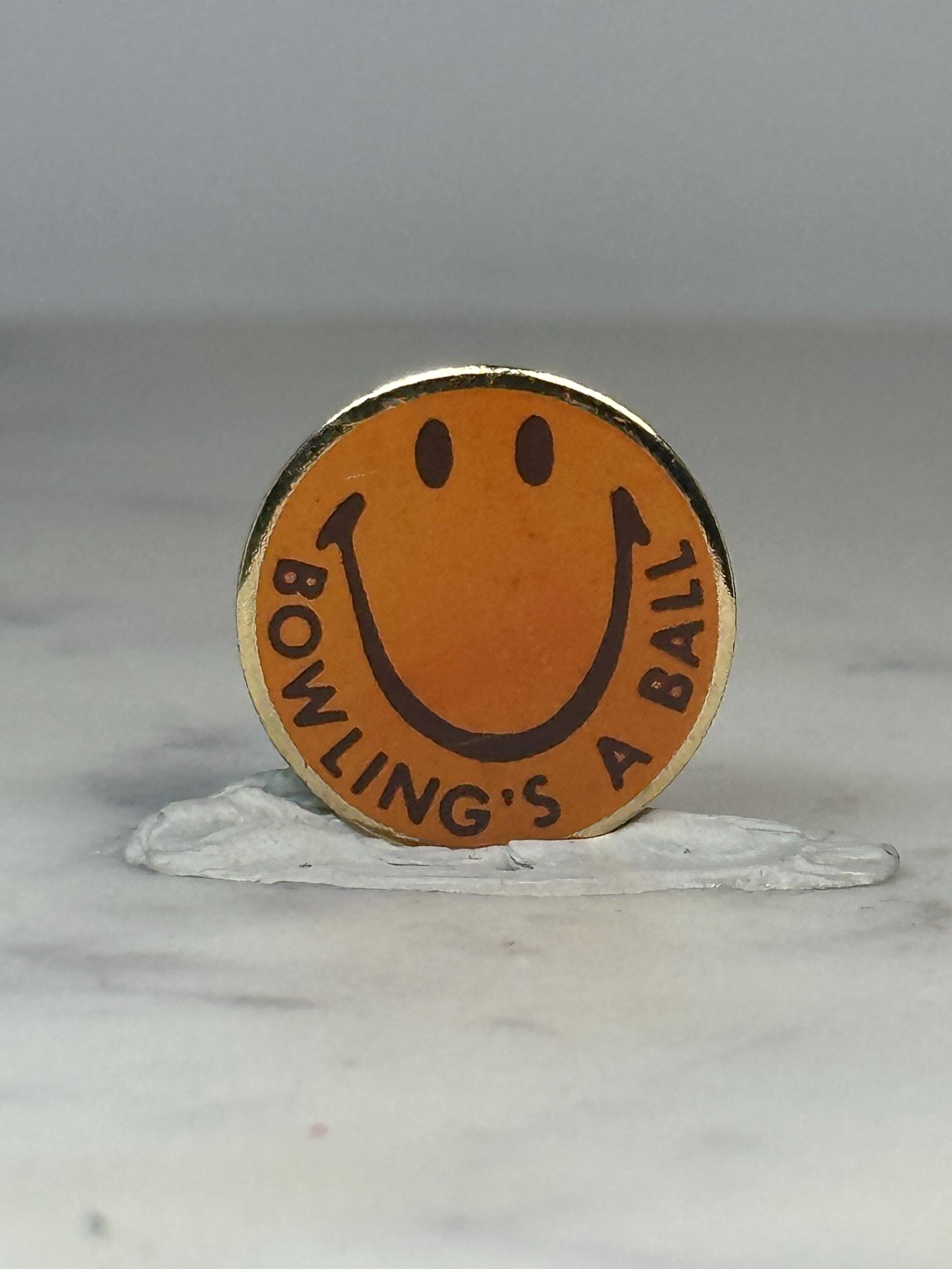Bowling Smile Face Pin: Yellow Enamel Round - Retro Humor Accessory