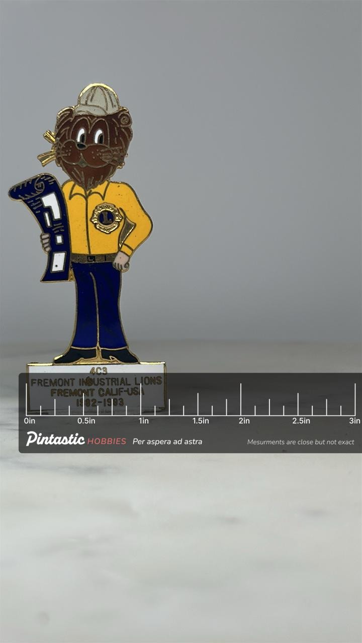 Fremont Industrial Lions Pin: Enamel & Gold Tone - 1980s Club Accessory with ruler overlay for size reference