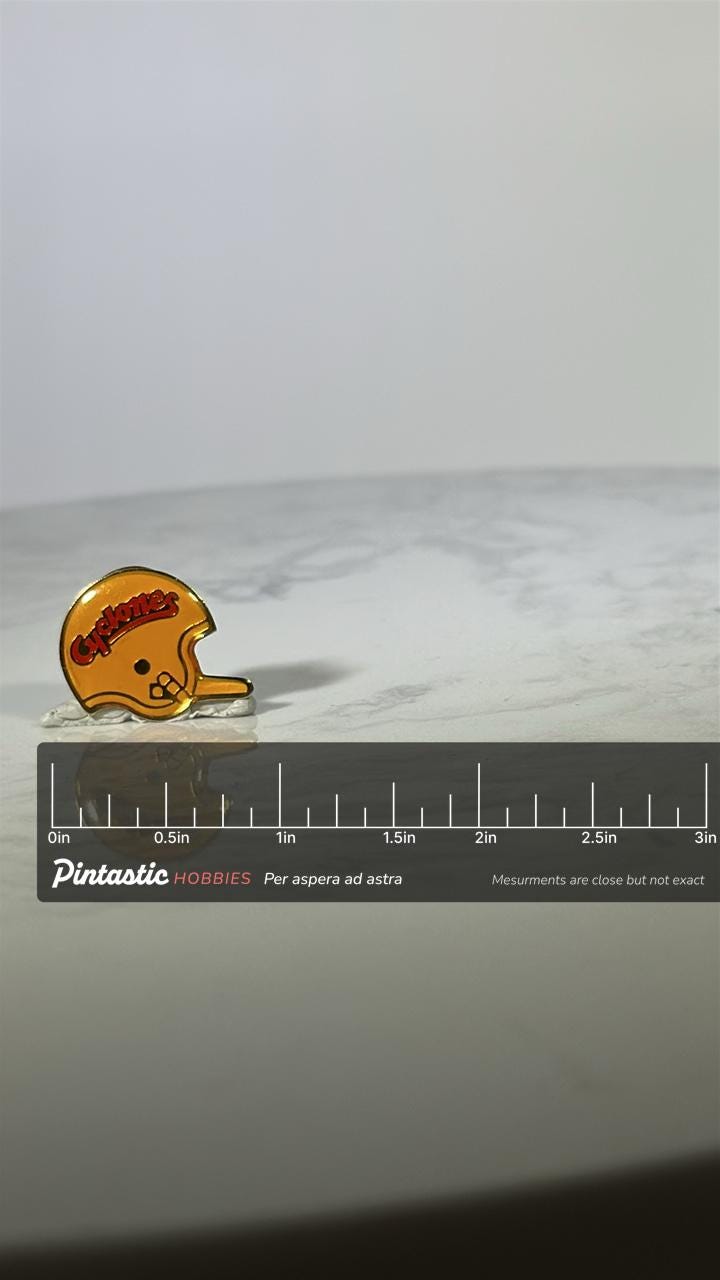 Iowa State Cyclones Football Helmet Pin: Yellow Enamel - Vintage Sports Accessory with ruler overlay for size reference
