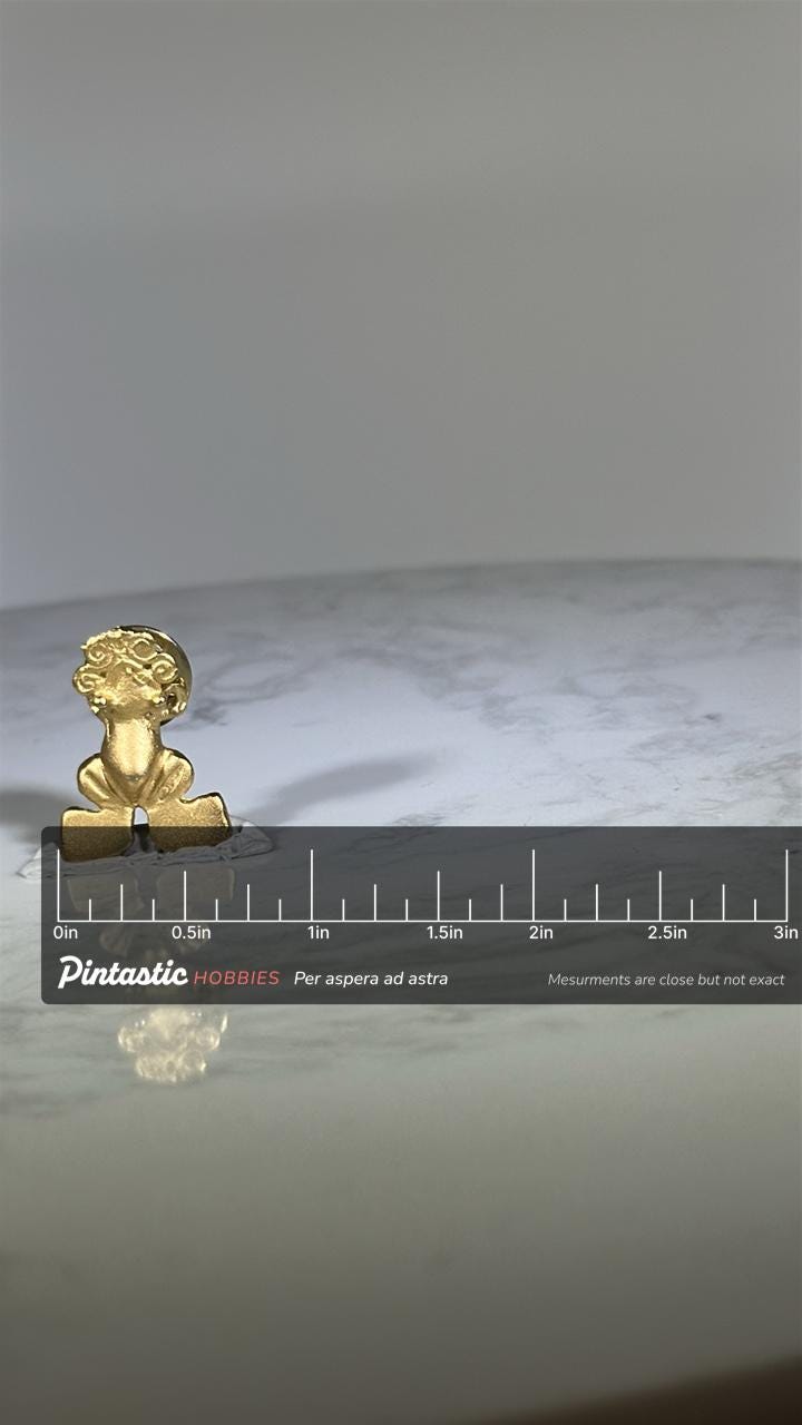 Whimsical Frog Figure Pin: Matte Gold Finish - Vintage Animal Accessory with ruler overlay for size reference