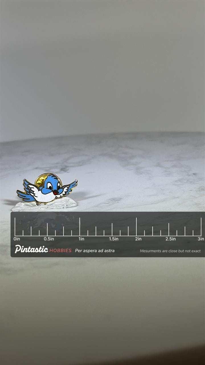 Bluebird Cartoon Pin: Enamel & Gold-Tone - Whimsical Vintage Accessory with ruler overlay for size reference