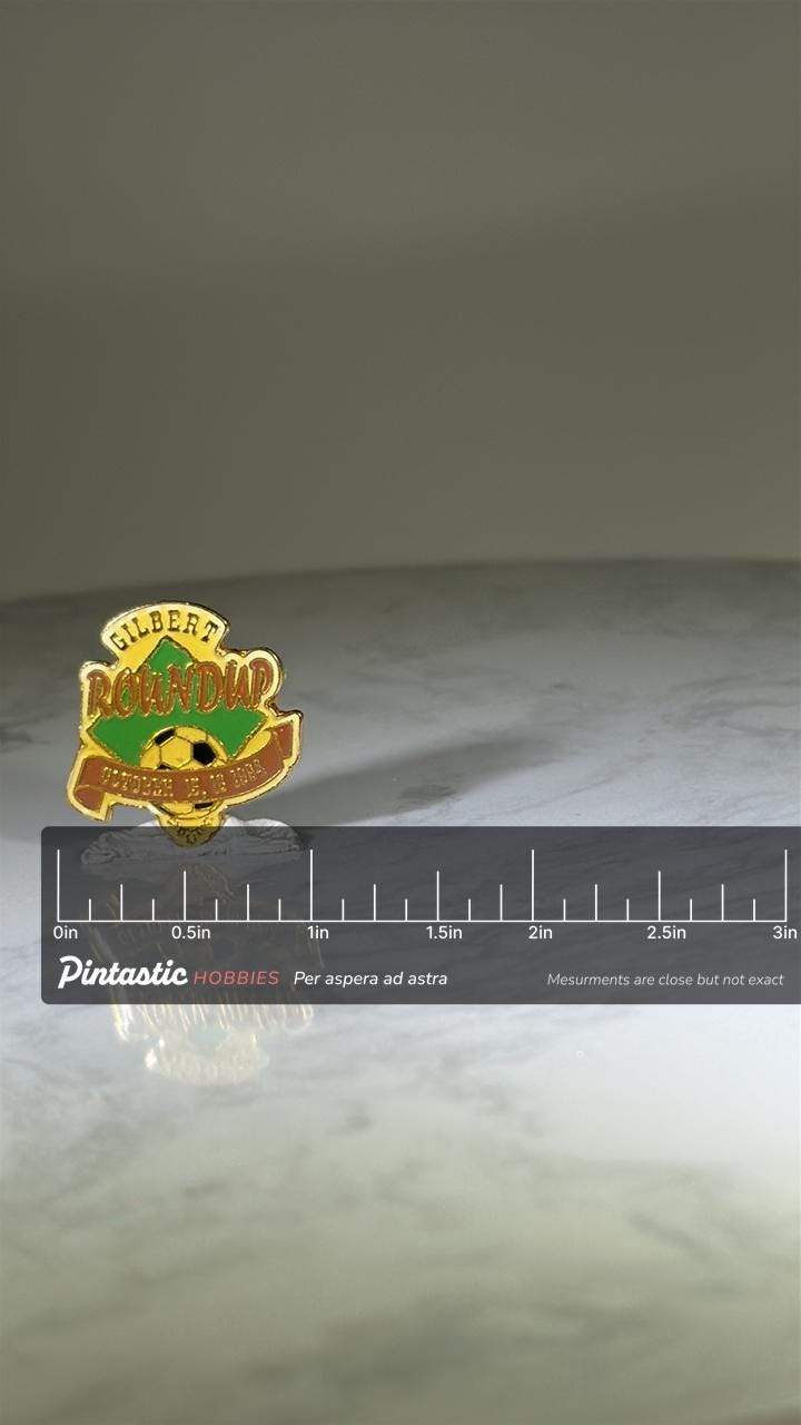 Gilbert Roundup Soccer Pin: Gold Green Enamel - 1994 Sports Accessory with ruler overlay for size reference