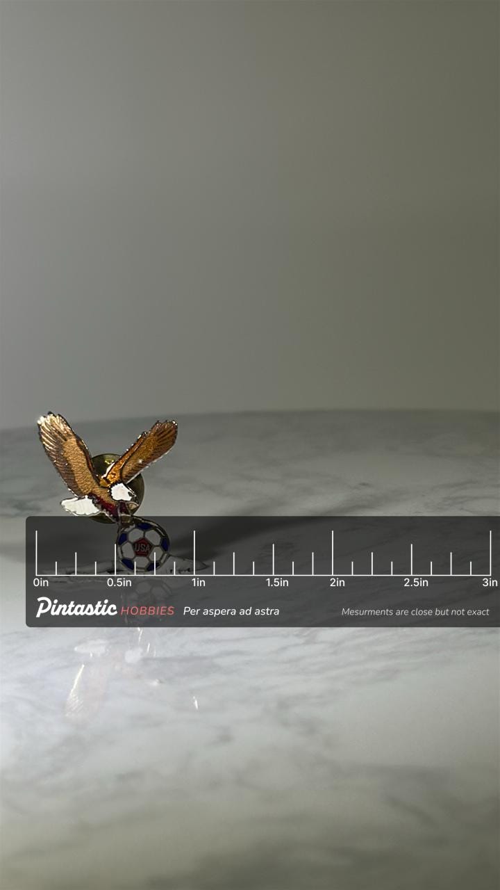 USA Soccer Eagle Pin: Enamel Goldtone - Patriotic Sports Accessory with ruler overlay for size reference