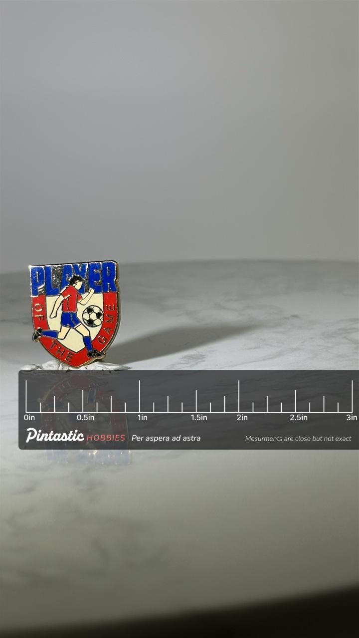 Soccer Player of the Game Pin: Red Blue Enamel - Vintage Sports Accessory with ruler overlay for size reference