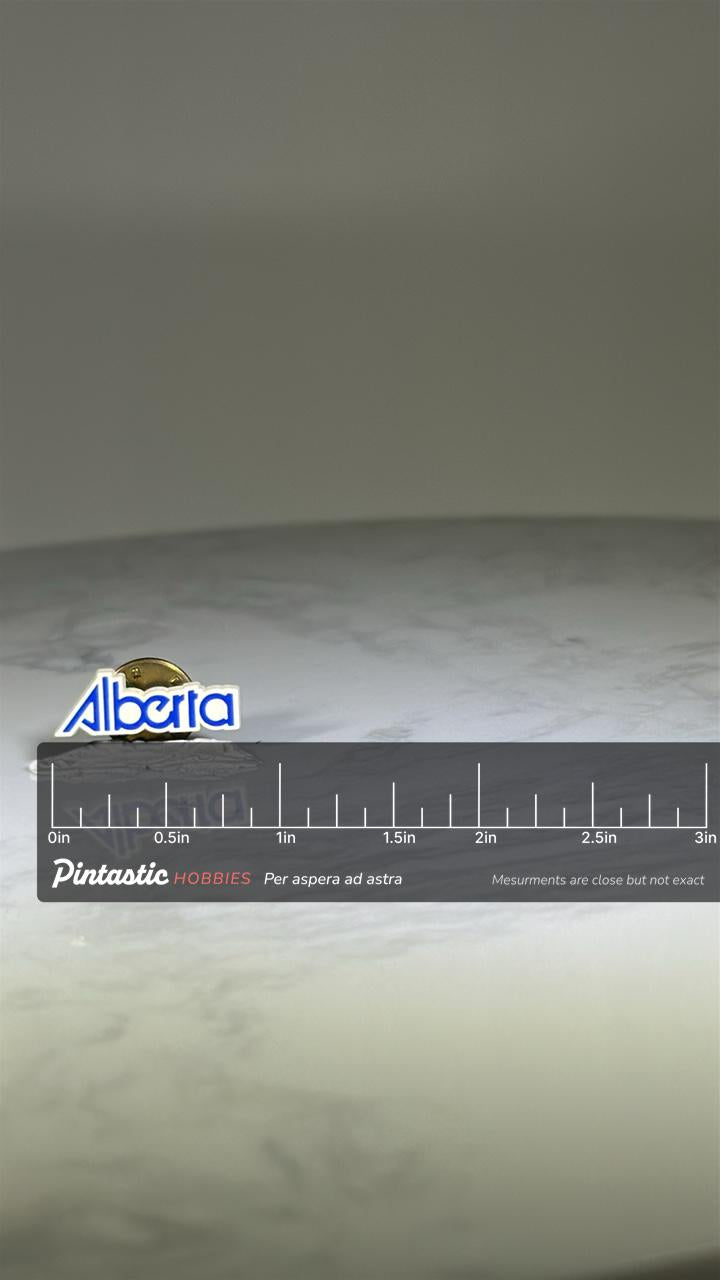 Alberta Souvenir Pin: White & Blue Enamel - Vintage Travel Accessory with ruler overlay for size reference