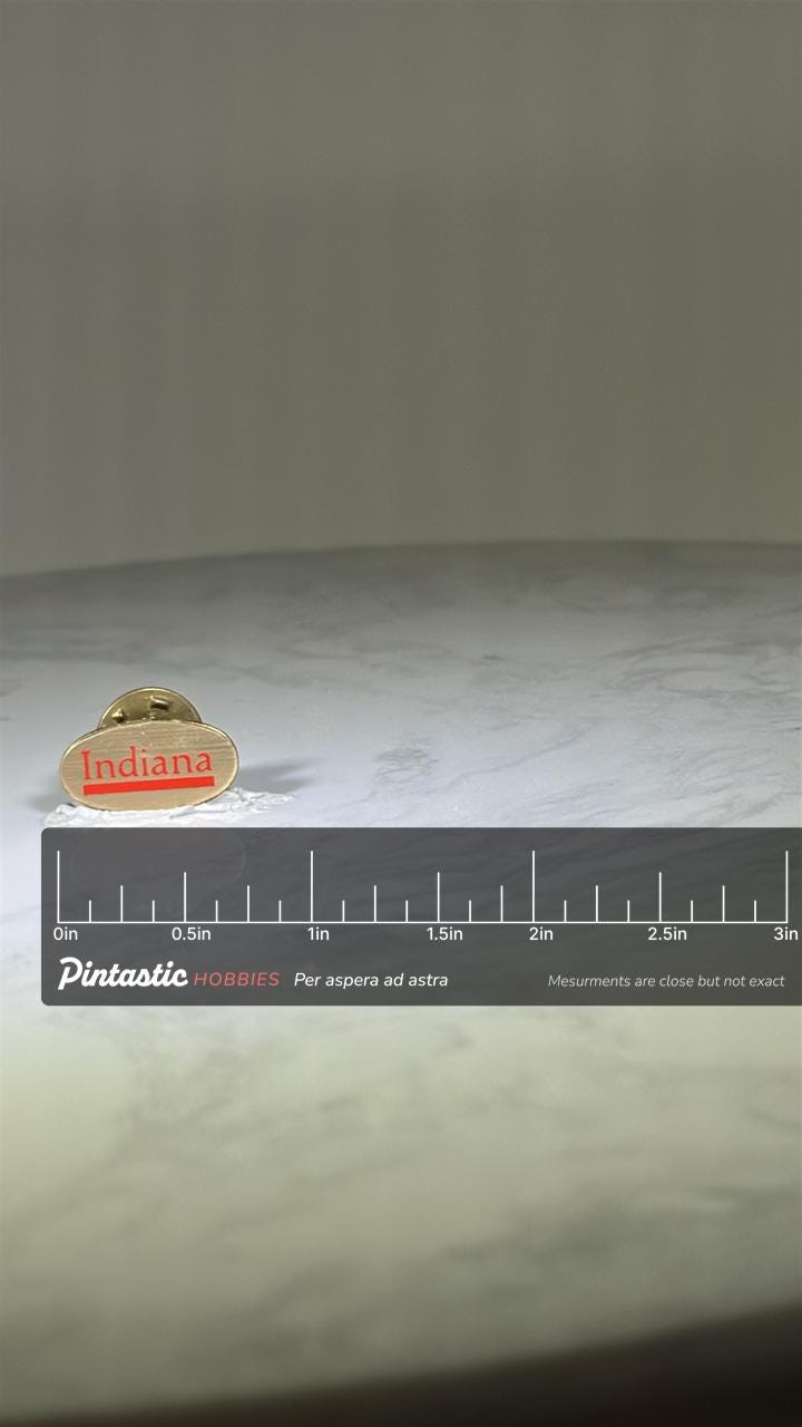 Indiana State Pin: Gold Tone Red Text - Vintage Travel Accessory with ruler overlay for size reference