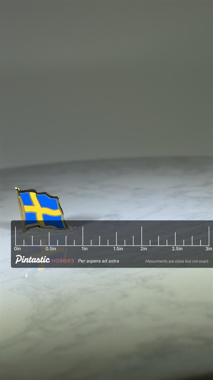 Sweden Flag Pin: Blue & Yellow Enamel - Patriotic Travel Accessory with ruler overlay for size reference