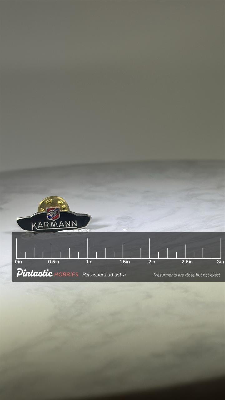 Karmann Logo Pin: Black Enamel Silver Trim - Classic Car Accessory with ruler overlay for size reference