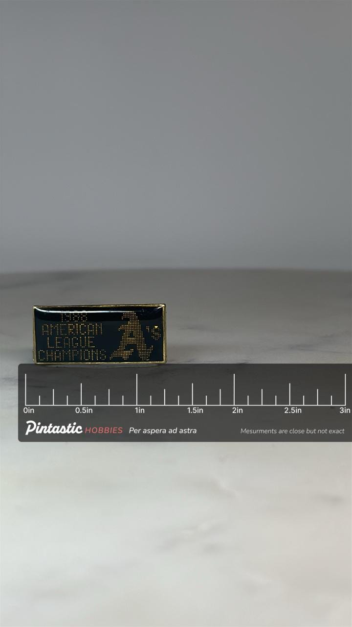 1988 Oakland A's Pin: Black Gold Enamel - Baseball Memorabilia Accessory with ruler overlay for size reference