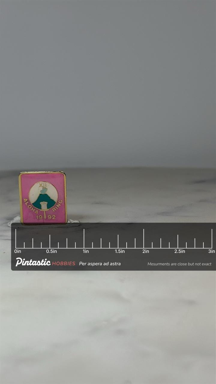 Aloha Ring XII Pin: Pink & Gold Enamel - 1992 Event Accessory with ruler overlay for size reference
