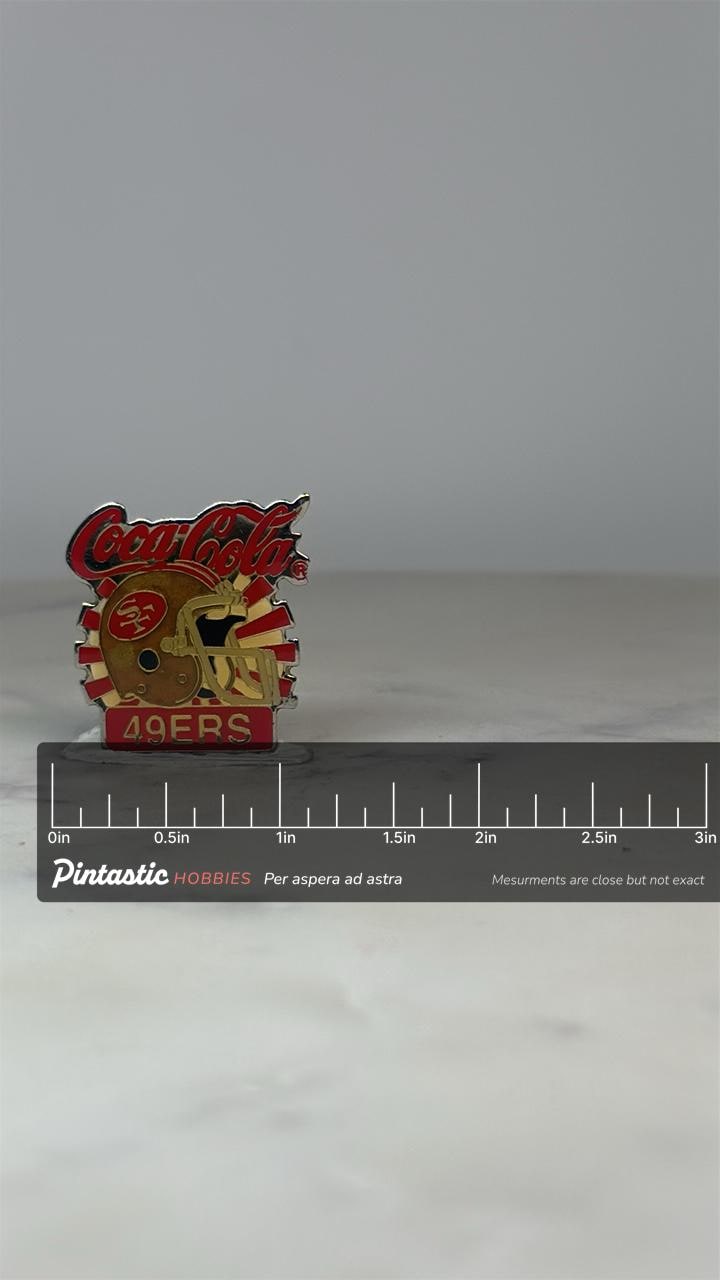 49ers Coca-Cola Pin: Red Gold Enamel - Vintage NFL Sports Accessory with ruler overlay for size reference