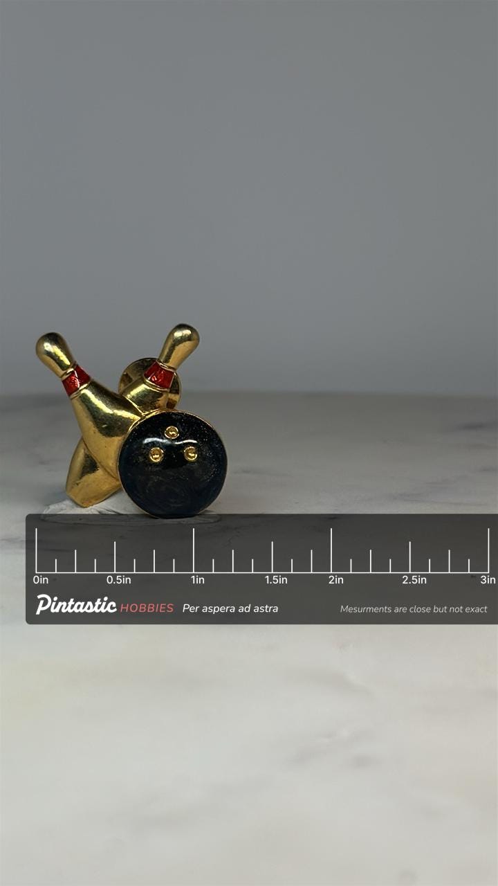 Bowling Pins Tie Tac: Gold & Black Enamel - Retro Sports Accessory with ruler overlay for size reference
