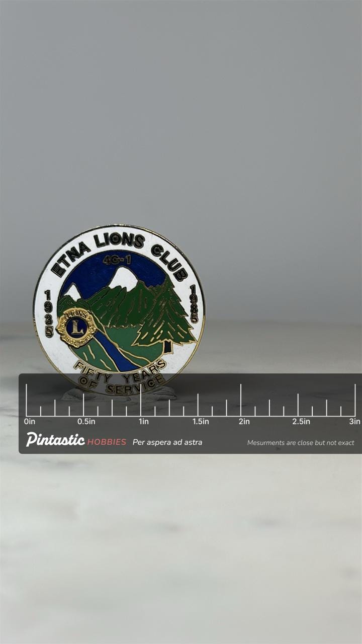Etna Lions Club Pin: Gold Enamel Finish - 1985 Service Anniversary Accessory with ruler overlay for size reference