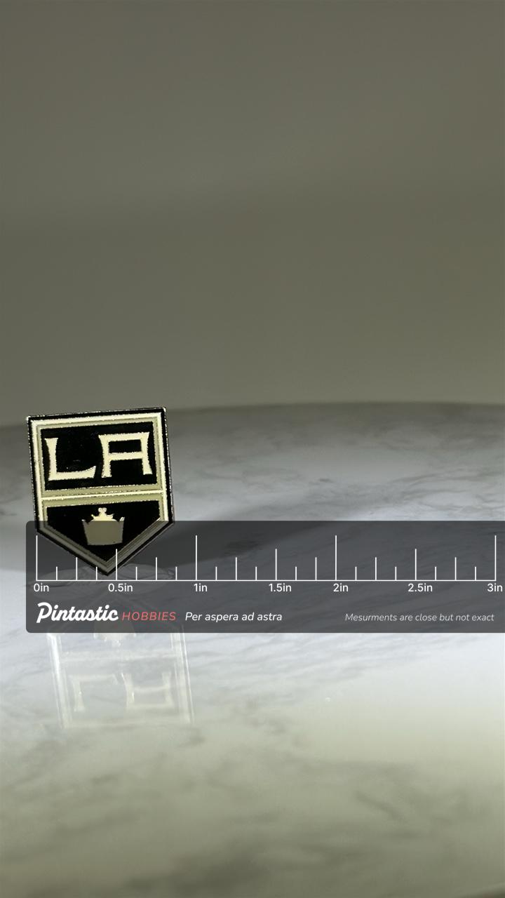 LA Kings Hockey Pin: Black & Silver Enamel - NHL Sports Accessory with ruler overlay for size reference
