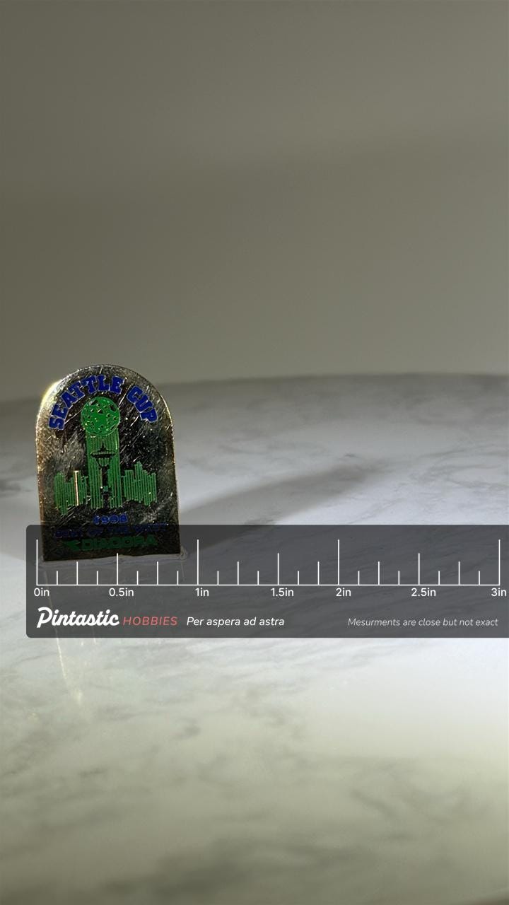Seattle Cup Soccer Pin: Gold Finish - 1998 Diadora Sports Accessory with ruler overlay for size reference