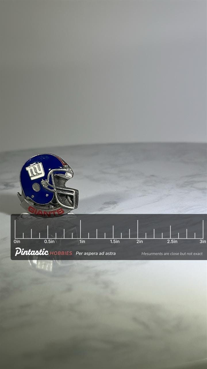 NY Giants Football Helmet Pin: Blue Silver Enamel - Vintage Sports Accessory with ruler overlay for size reference