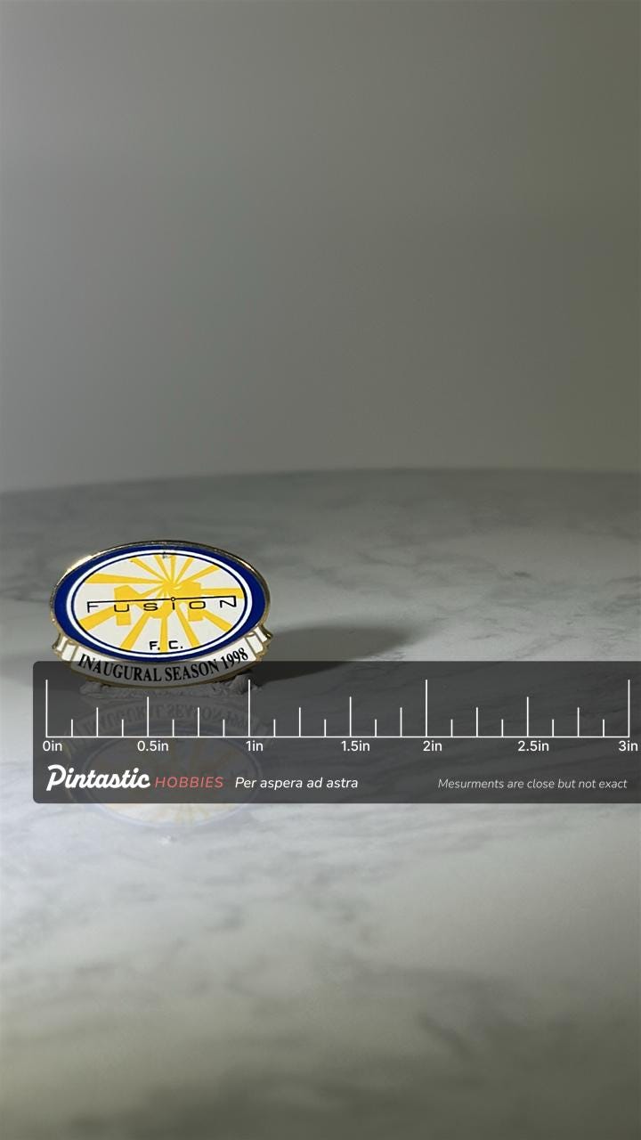 Fusion F.C. Soccer Pin: Blue & Yellow Enamel - 1998 Inaugural Season Accessory with ruler overlay for size reference