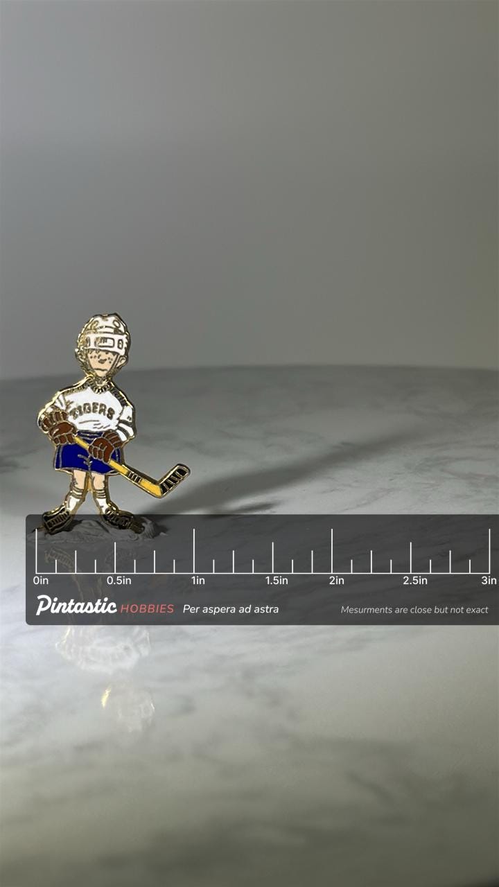 Hockey Player Pin: Enamel Gold-Tone - Vintage Sports Accessory with ruler overlay for size reference
