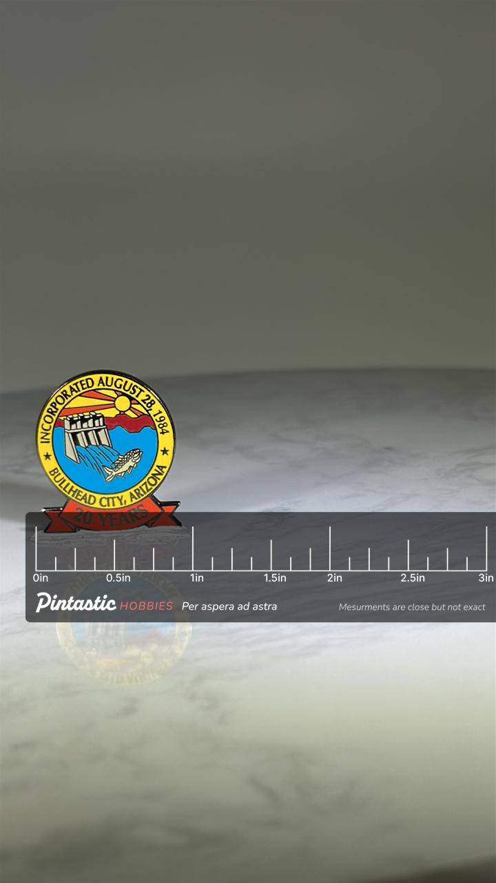 Bullhead City AZ Commemorative Pin: Colorful Enamel Finish - 1980s City Souvenir with ruler overlay for size reference