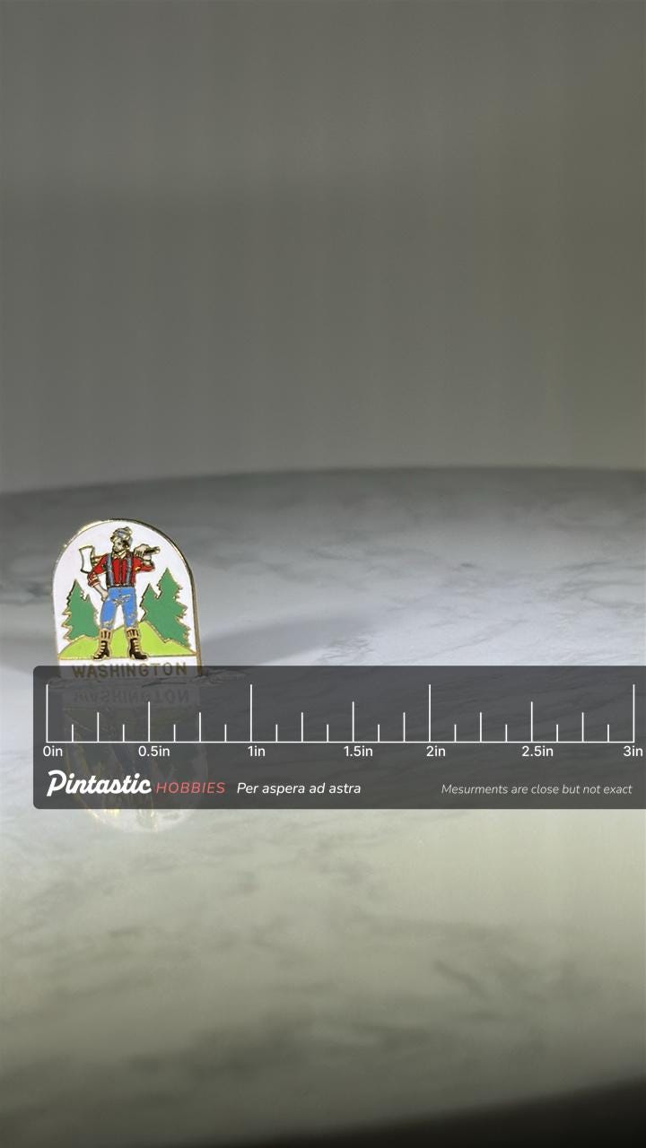 Washington Lumberjack Souvenir Pin: Enamel Color - Vintage Travel Accessory with ruler overlay for size reference