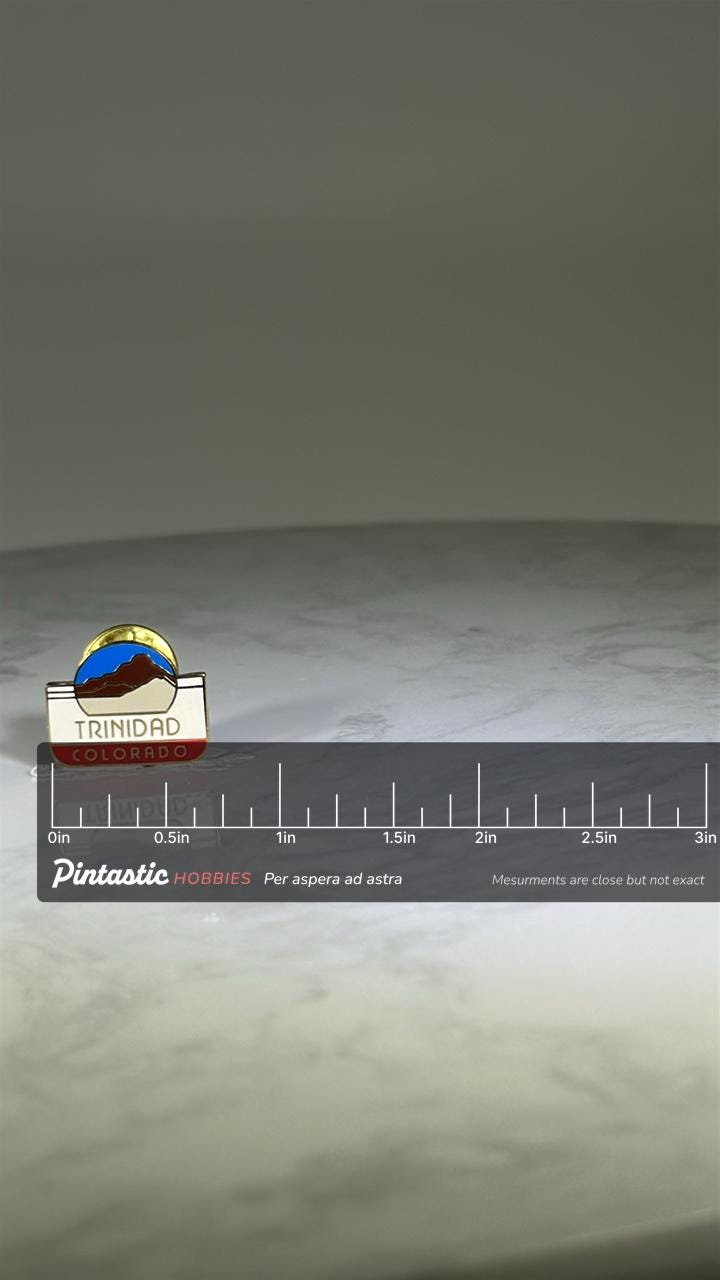 Trinidad Colorado Travel Pin: Enamel Gold-Tone - Vintage Souvenir Accessory with ruler overlay for size reference