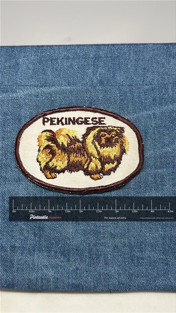 Pekingese Dog Patch: Sew-On Oval Yellow-Brown - Vintage Dog Accessory with ruler overlay for size reference