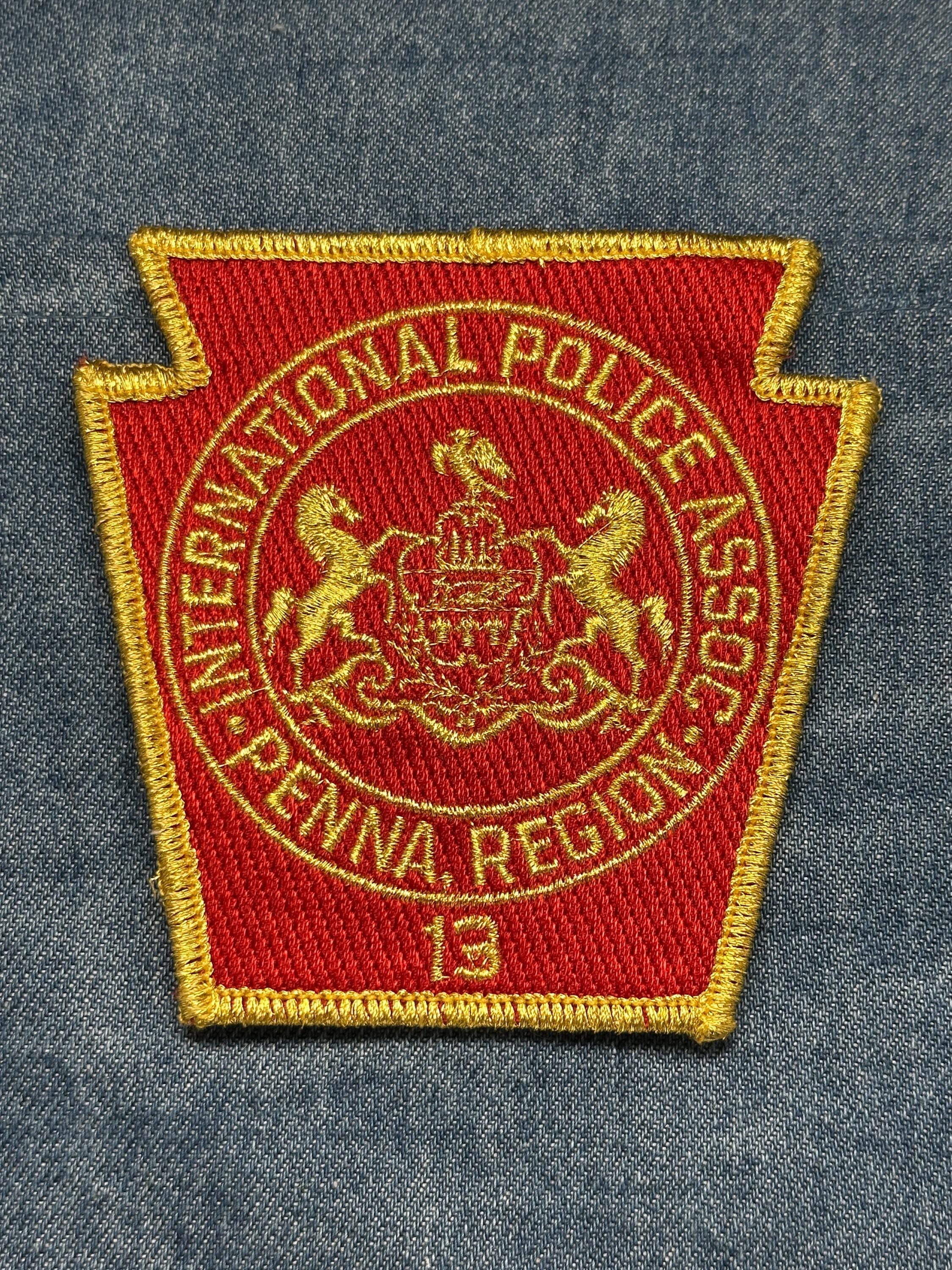 International Police Assoc Collectable Patch: Sew-On Red Gold - Law Enforcement Accessory