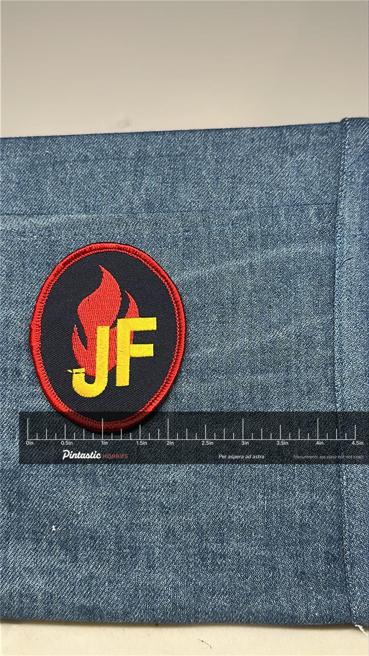 Fire Flame JF Collectable Patch: Iron-On Black/Red Round - Firefighter Accessory with ruler overlay for size reference