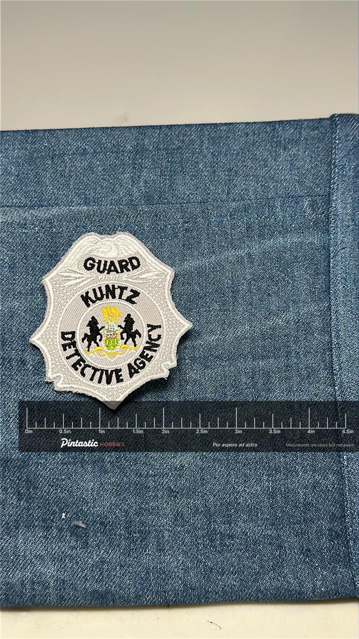 Kuntz Detective Agency Collectable Patch: Sew-On Silver Shield - Security Accessory with ruler overlay for size reference