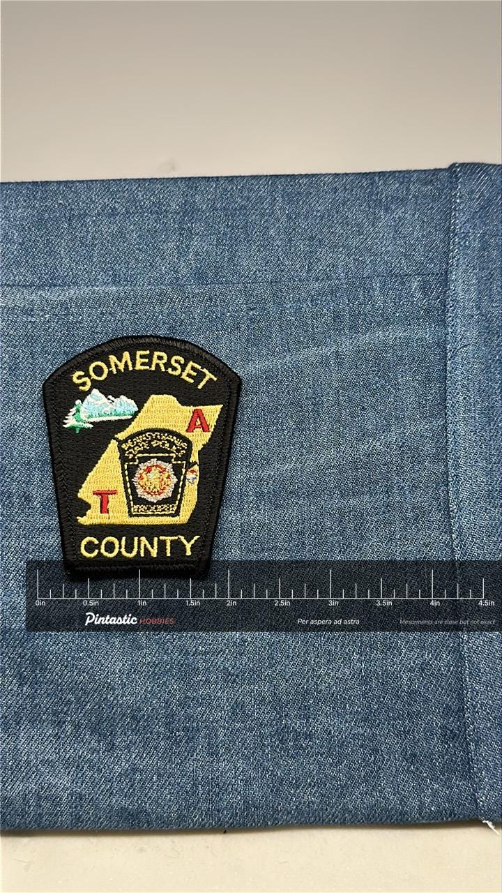 Somerset County Collectable Patch: Iron-On Black/Gold - Government Accessory with ruler overlay for size reference