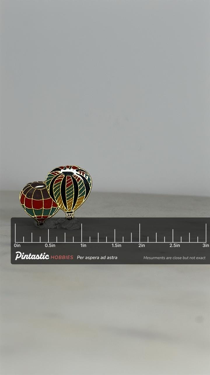 Hot air balloon enamel pin: multicolor gold-tone - retro travel accessory with ruler overlay for size reference