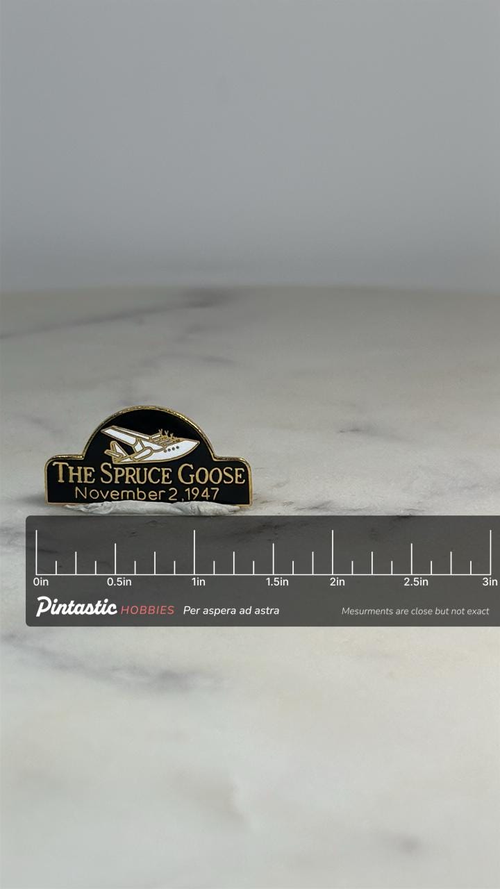 Spruce Goose Airplane Pin: Black & Gold Enamel - Aviation History Accessory with ruler overlay for size reference