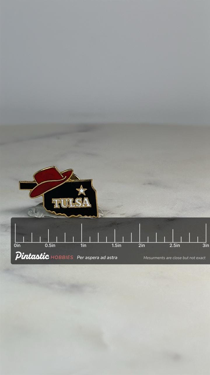 Tulsa Oklahoma State Pin: Red Hat Black Enamel - Vintage Souvenir Accessory with ruler overlay for size reference