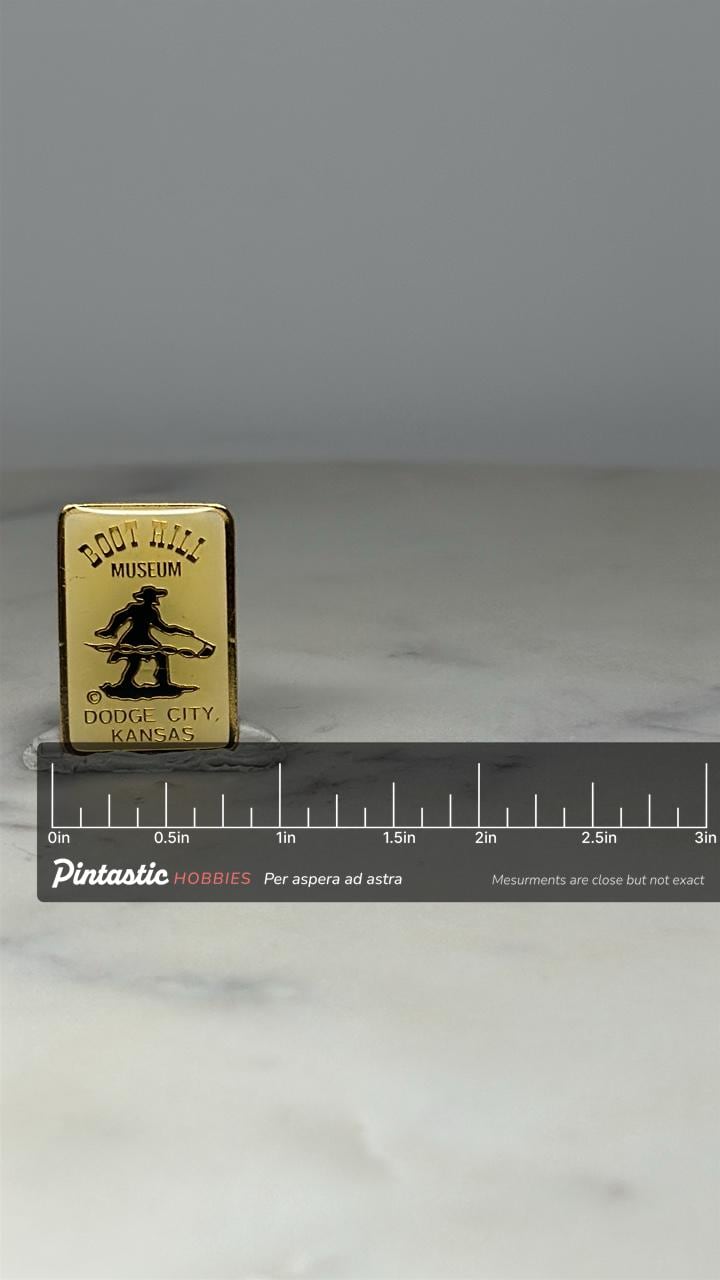 Boot Hill Museum Souvenir Pin: Gold Tone Cowboy - Western Travel Accessory with ruler overlay for size reference