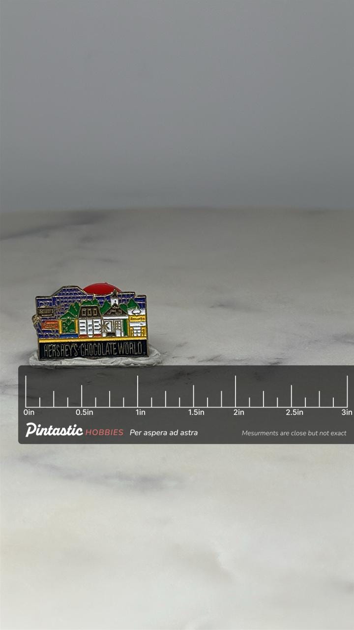 Hershey's Chocolate World Souvenir Pin: Enamel Multicolor - Vintage Travel Accessory with ruler overlay for size reference