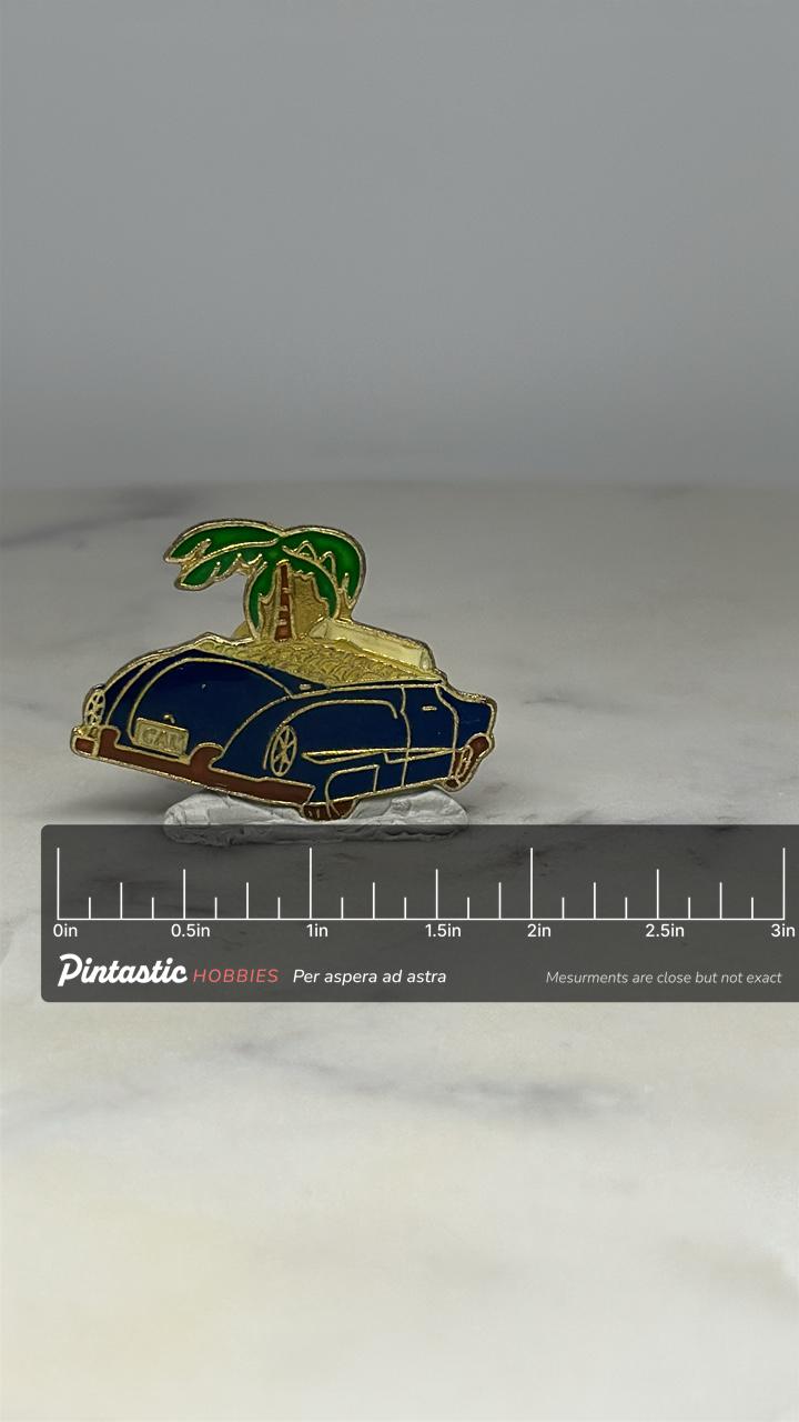 Vintage Car & Palm Tree Lapel Pin: Blue Enamel Finish - Tropical Beach Accessory with ruler overlay for size reference