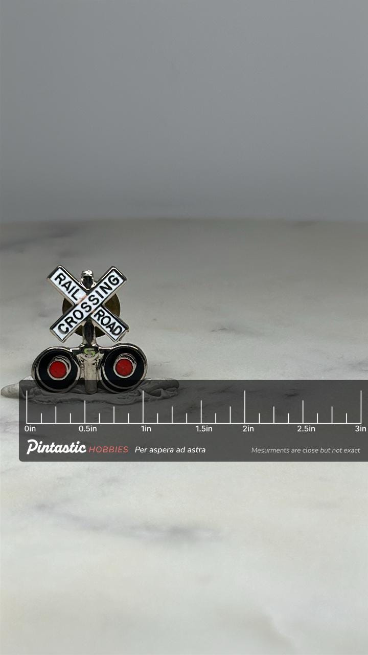 Railroad Crossing Enamel Pin: Silver & Red - Vintage Transit Accessory with ruler overlay for size reference