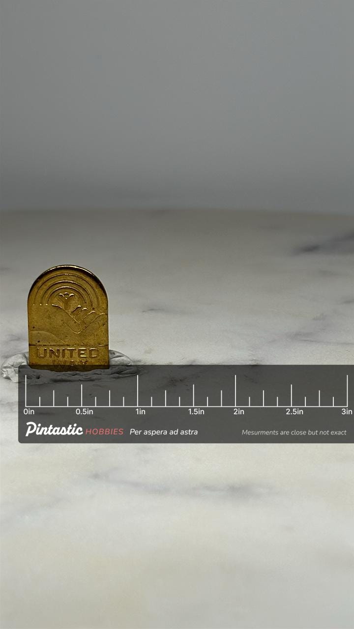 United Way Lapel Pin: Gold Tone Badge - Vintage Charity Accessory with ruler overlay for size reference
