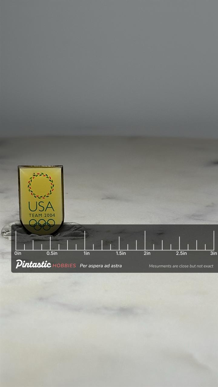 USA Olympics Pin: Yellow Shield Design - Team 2004 Collectible Accessory with ruler overlay for size reference