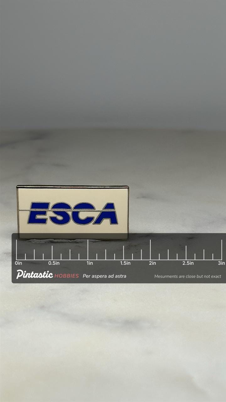 ESCA Logo Pin: Blue Enamel on White - Vintage Company Accessory with ruler overlay for size reference