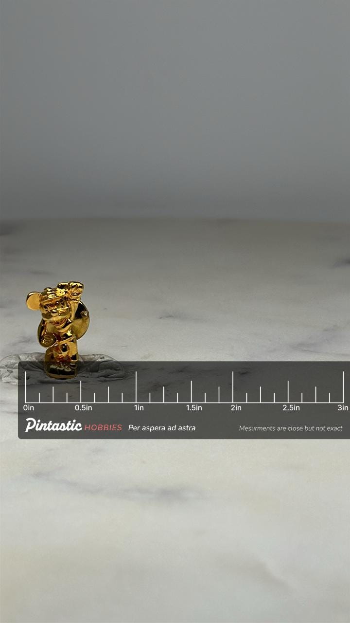Mickey Mouse Golfing Pin: Gold Tone Finish - Vintage Disney Accessory with ruler overlay for size reference